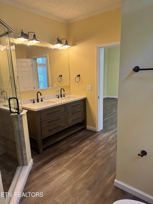 337 Costner Rd, Cosby, TN 37722 - full bathroom with a stall shower, a sink, ornamental molding, and wood finished floors