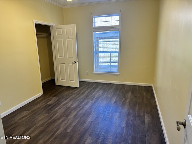 337 Costner Rd, Cosby, TN 37722 - unfurnished bedroom featuring ornamental molding, baseboards, a closet, and dark wood finished floors