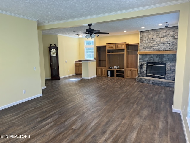 337 Costner Rd, Cosby, TN 37722 - unfurnished living room with baseboards, a fireplace, a textured ceiling, dark wood-type flooring, and ceiling fan