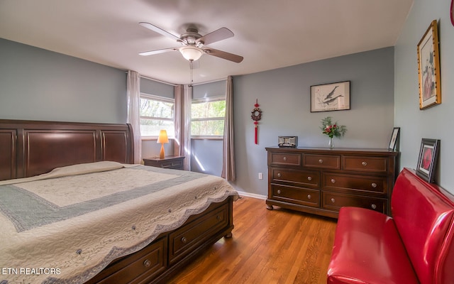 bedroom featuring ceiling fan and wood finished floors