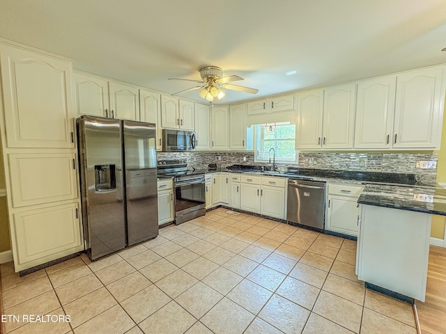 kitchen featuring backsplash, appliances with stainless steel finishes, ceiling fan, and light tile patterned floors