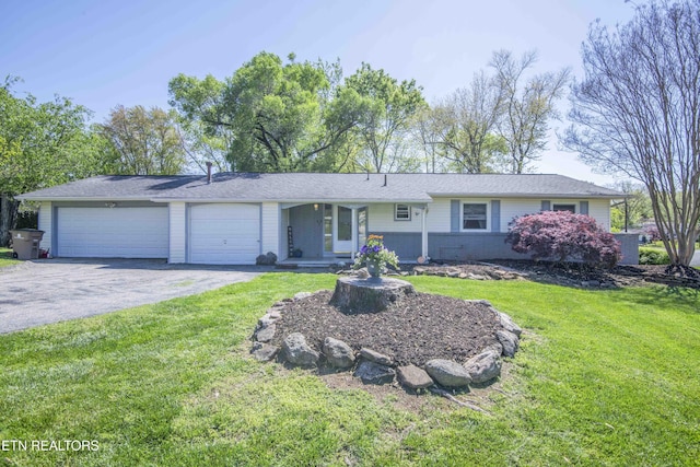 ranch-style home with an attached garage, driveway, and a front lawn