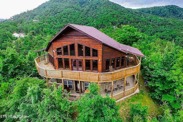 3219 Grouse Ridge Ln, Sevierville, TN 37862 - back of property featuring a wooded view and a balcony