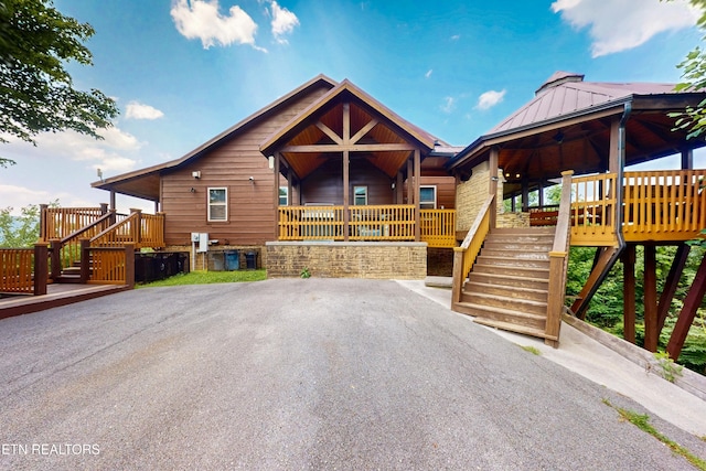 3219 Grouse Ridge Ln, Sevierville, TN 37862 - chalet / cabin featuring stairs, a standing seam roof, a metal roof, and ceiling fan