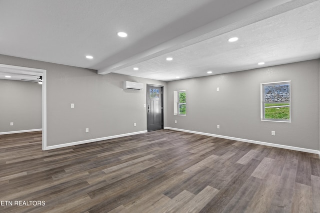 613 N St, Newport, TN 37821 - below grade area featuring recessed lighting, baseboards, an AC wall unit, and dark wood-type flooring