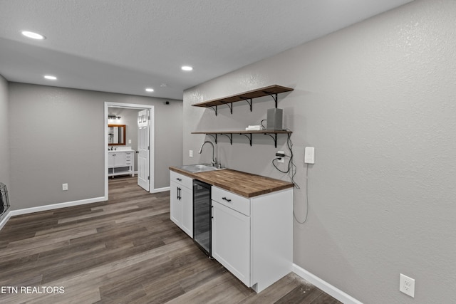 613 N St, Newport, TN 37821 - bar with wet bar, beverage cooler, baseboards, and a sink