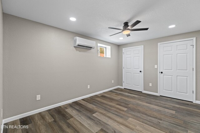 613 N St, Newport, TN 37821 - unfurnished bedroom featuring recessed lighting, an AC wall unit, baseboards, and dark wood-style flooring