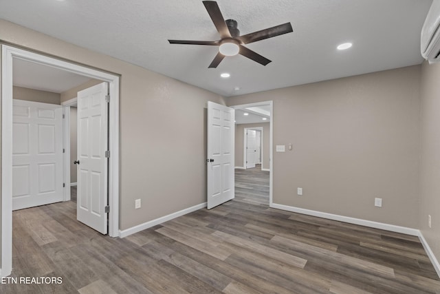 613 N St, Newport, TN 37821 - unfurnished bedroom featuring recessed lighting, wood finished floors, a ceiling fan, baseboards, and a wall mounted AC
