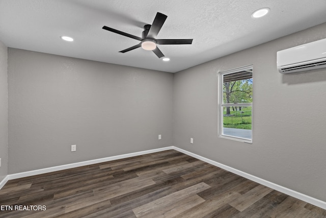 613 N St, Newport, TN 37821 - spare room with recessed lighting, a ceiling fan, a wall mounted AC, and dark wood-type flooring