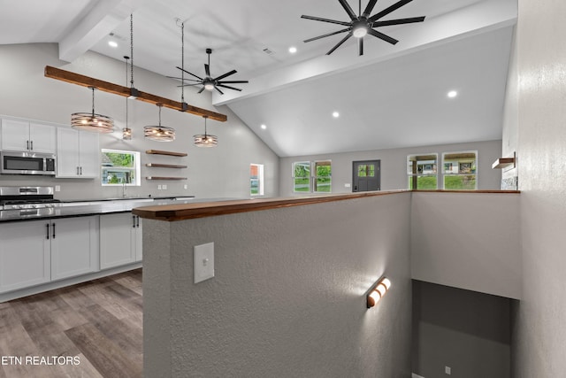 613 N St, Newport, TN 37821 - kitchen featuring white cabinets, stainless steel appliances, beam ceiling, a ceiling fan, and wood finished floors