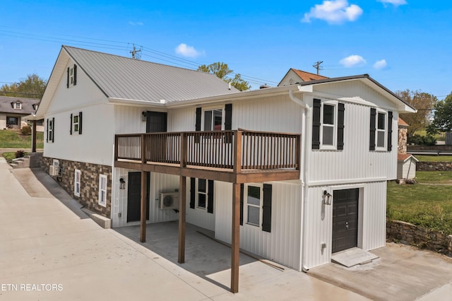 613 N St, Newport, TN 37821 - rear view of house featuring ac unit and stone siding