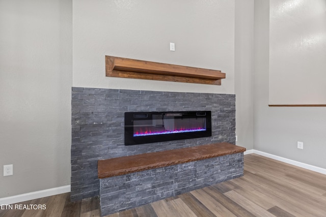 613 N St, Newport, TN 37821 - interior details featuring baseboards, wood finished floors, and a fireplace