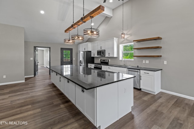 613 N St, Newport, TN 37821 - kitchen featuring white cabinets, a wealth of natural light, and appliances with stainless steel finishes