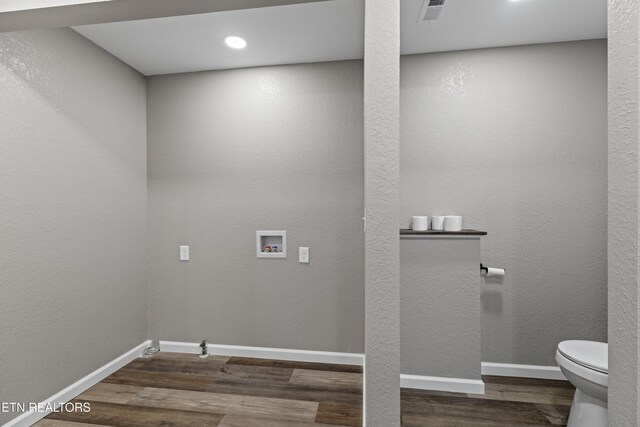 613 N St, Newport, TN 37821 - laundry area with hookup for a washing machine, baseboards, wood finished floors, and visible vents