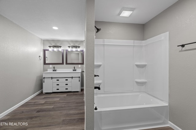 613 N St, Newport, TN 37821 - bathroom featuring vanity, baseboards, shower / washtub combination, and wood finished floors