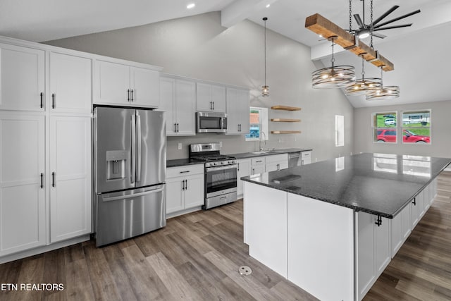 613 N St, Newport, TN 37821 - kitchen with white cabinets, dark wood-style floors, beam ceiling, high vaulted ceiling, and appliances with stainless steel finishes
