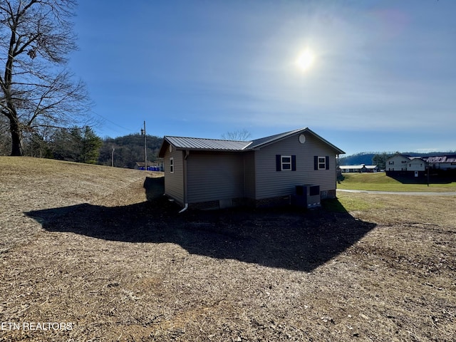 155 Oak Tree Ln, Sneedville, TN 37869 - view of side of home with central AC and metal roof