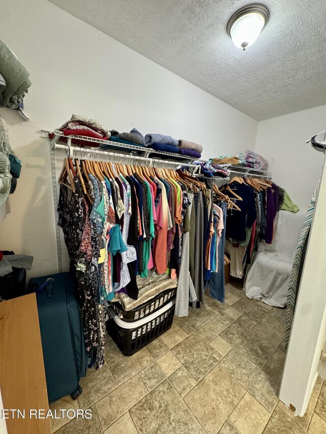 155 Oak Tree Ln, Sneedville, TN 37869 - walk in closet featuring stone finish floor