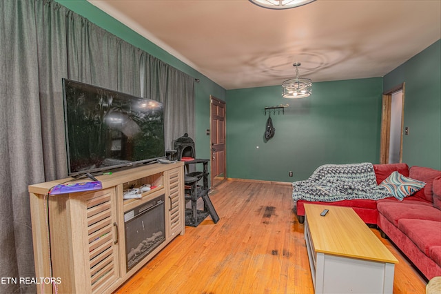 living area featuring light wood-style floors and baseboards