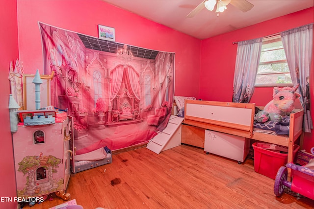bedroom with wood finished floors and ceiling fan