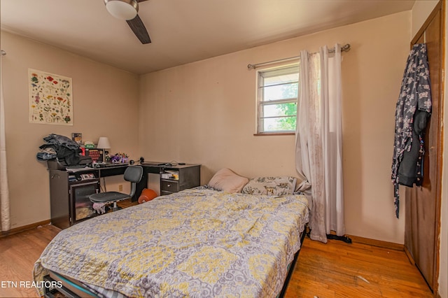 bedroom featuring wood finished floors and ceiling fan