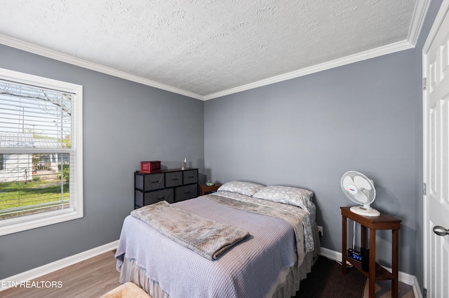 648 Old Douglas Dam Rd, Sevierville, TN 37876 - bedroom with crown molding, a textured ceiling, baseboards, and wood finished floors