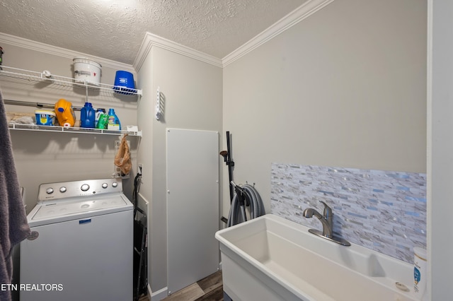 648 Old Douglas Dam Rd, Sevierville, TN 37876 - clothes washing area featuring a sink, laundry area, a textured ceiling, washer / clothes dryer, and ornamental molding