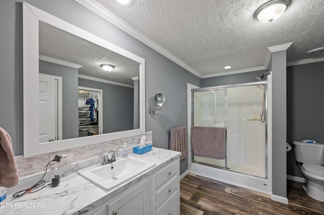 648 Old Douglas Dam Rd, Sevierville, TN 37876 - bathroom featuring vanity, toilet, a shower stall, and wood finished floors