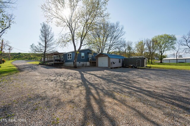 648 Old Douglas Dam Rd, Sevierville, TN 37876 - view of front of home featuring driveway, an outbuilding, crawl space, and a detached garage