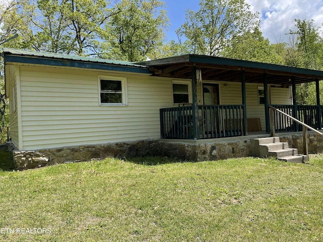 430 Buell Ln, Speedwell, TN 37870 - exterior space with a front yard and covered porch