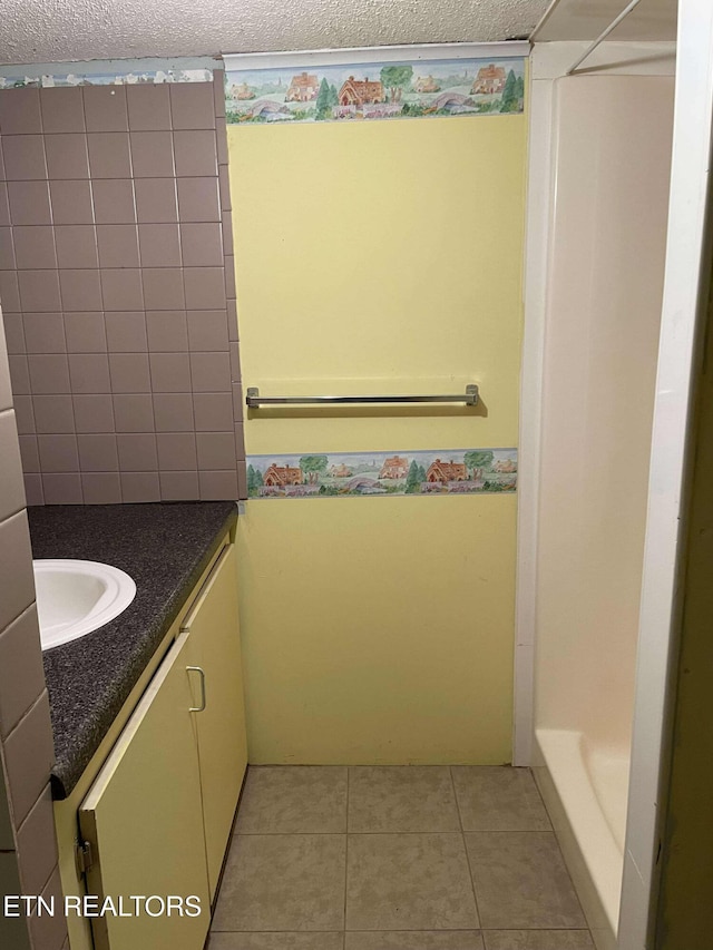 430 Buell Ln, Speedwell, TN 37870 - bathroom with tile patterned flooring, vanity, and a textured ceiling