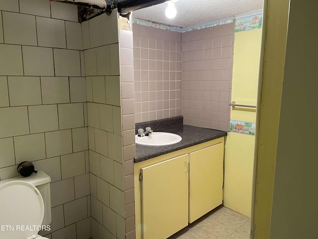 430 Buell Ln, Speedwell, TN 37870 - bathroom featuring vanity, toilet, tile patterned flooring, and tile walls
