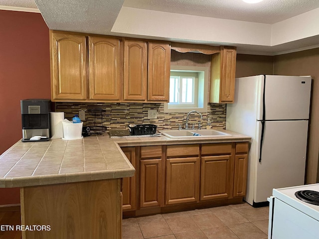 430 Buell Ln, Speedwell, TN 37870 - kitchen featuring tile counters, white appliances, a sink, and tasteful backsplash