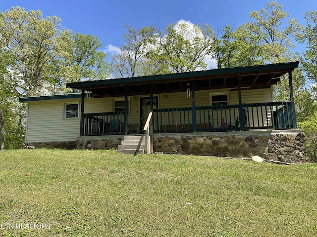 430 Buell Ln, Speedwell, TN 37870 - view of front of property with a front lawn and covered porch