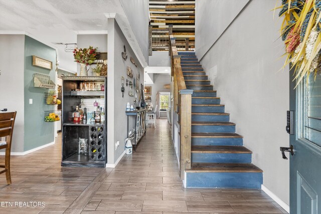 1842 Chapel Rd, Sevierville, TN 37876 - stairway featuring a bar, baseboards, and wood finish floors