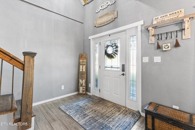 1842 Chapel Rd, Sevierville, TN 37876 - foyer entrance featuring baseboards, a towering ceiling, and wood finished floors