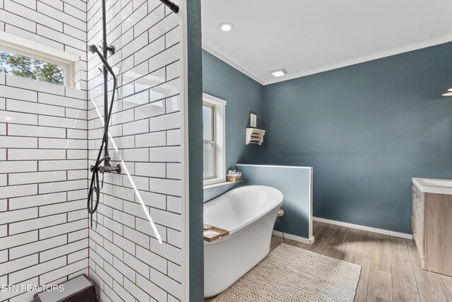 1842 Chapel Rd, Sevierville, TN 37876 - bathroom with baseboards, a freestanding bath, recessed lighting, wood finished floors, and tiled shower