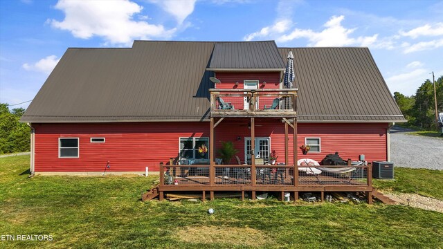 1842 Chapel Rd, Sevierville, TN 37876 - rear view of property featuring a balcony, a deck, cooling unit, a yard, and metal roof