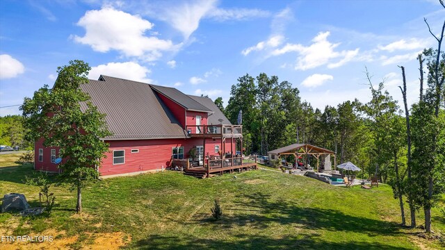 1842 Chapel Rd, Sevierville, TN 37876 - back of house with a gazebo, a yard, metal roof, and a wooden deck