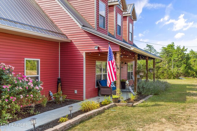 1842 Chapel Rd, Sevierville, TN 37876 - doorway to property with a yard and metal roof