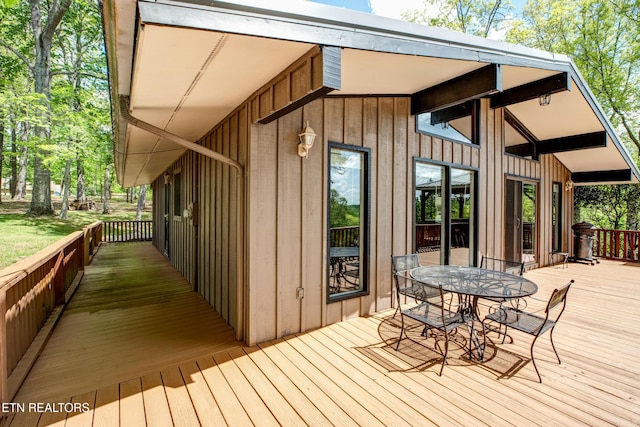 deck with outdoor dining space