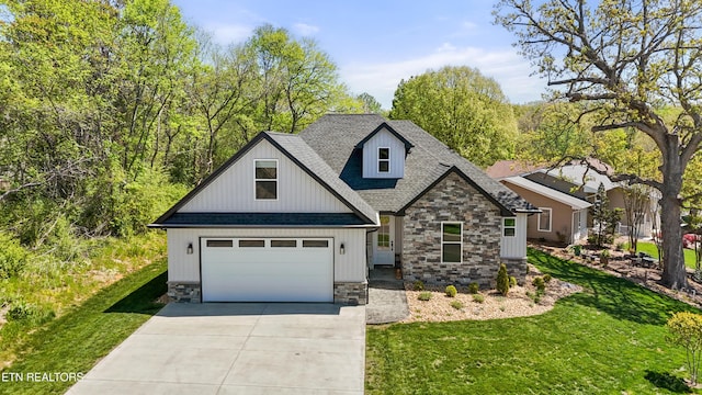 craftsman house featuring a front lawn, driveway, stone siding, a shingled roof, and an attached garage