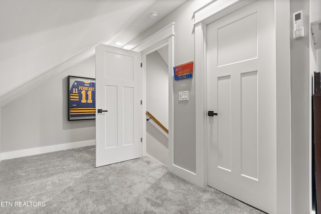bonus room featuring carpet floors and lofted ceiling