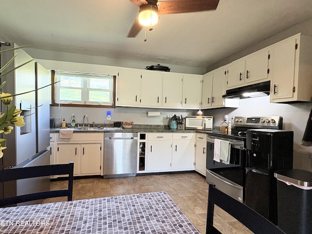 kitchen with a sink, ceiling fan, stainless steel appliances, white cabinetry, and under cabinet range hood