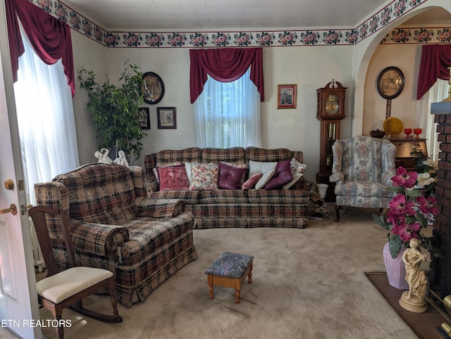 515 N 25th St, Middlesboro, KY 40965 - carpeted living room featuring arched walkways
