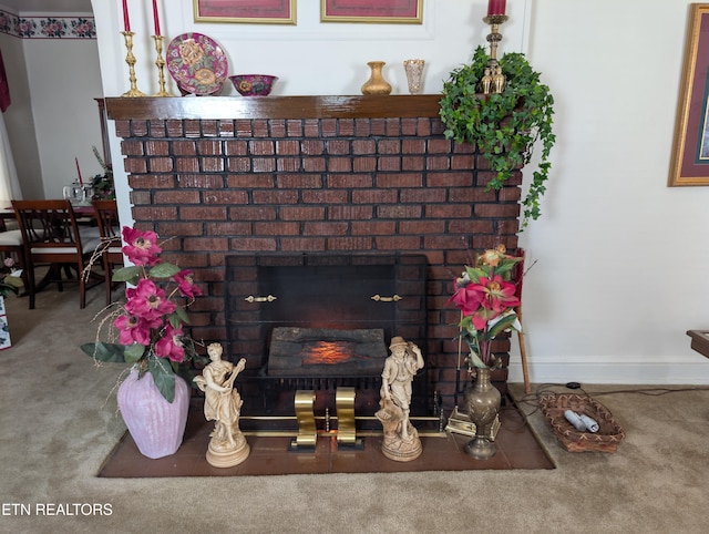 515 N 25th St, Middlesboro, KY 40965 - room details featuring a fireplace, carpet flooring, and baseboards