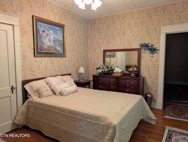 515 N 25th St, Middlesboro, KY 40965 - bedroom with wallpapered walls, ornamental molding, and wood finished floors
