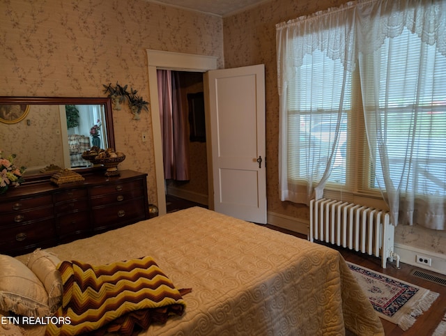 515 N 25th St, Middlesboro, KY 40965 - bedroom with radiator, wallpapered walls, visible vents, and multiple windows