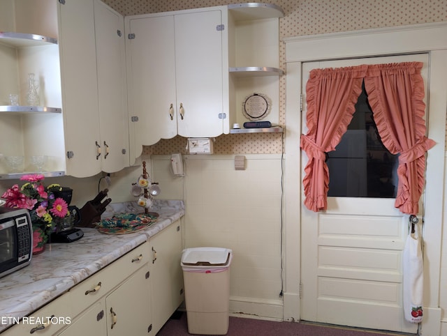 515 N 25th St, Middlesboro, KY 40965 - kitchen featuring white cabinetry, open shelves, and light countertops