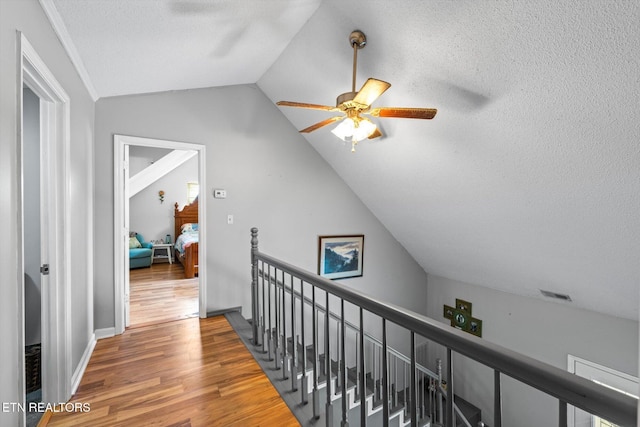 12903 Georgetown Village Ln, Georgetown, TN 37336 - hallway with an upstairs landing, wood finished floors, lofted ceiling, and a textured ceiling